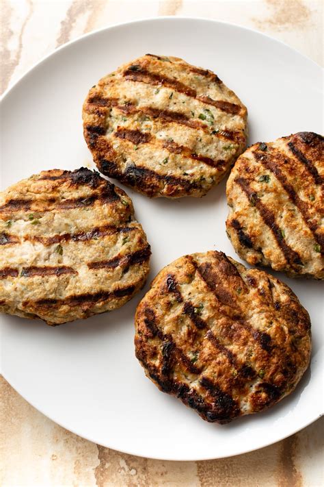 These chicken burgers are flavorful, fairly simple to make, and quite delicious. These grilled ground chicken burgers are easy to make ...