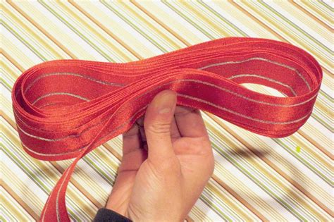 Cut two pieces of ribbon, one short (about 12 inches) and one long (depending on the size of your bow, 1 to 2 yards). How to make your own bows | Chica and Jo