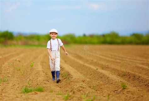 Cute Farmer Boy Standing In Potatoes Rows Stock Photo Image Of