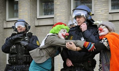 clowns hug cop police officer clown cops and robbers