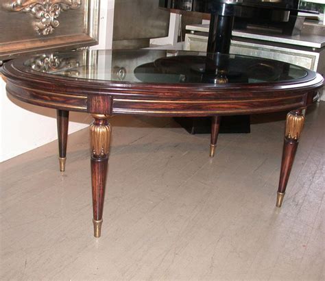 Elegant wooden coffee table with a glass top and wood magazine shelf below. ELEGANT FAUX MACASSAR WOOD FINISH GLASS OVAL COFFEE TABLE ...