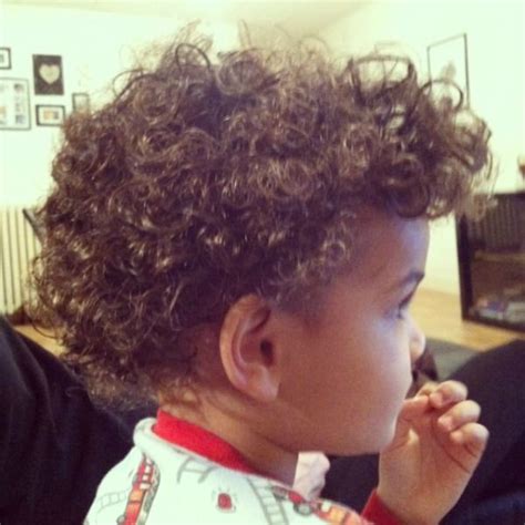 If your boy loves to flaunt the natural kinky appearance, give him this voluminous top which is full of those messy curls. 14 Tips for Styling Curly Hair | Curly hair baby boy ...