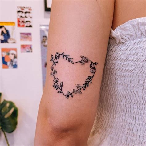 Heart Shaped Flower Wreath Tattoo On The Tricep