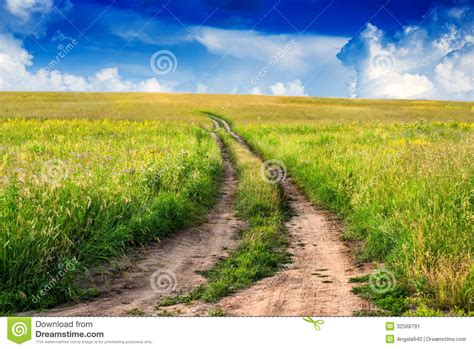 Peaceful Rural Landscape In Wide Field With Country Road Stock Image