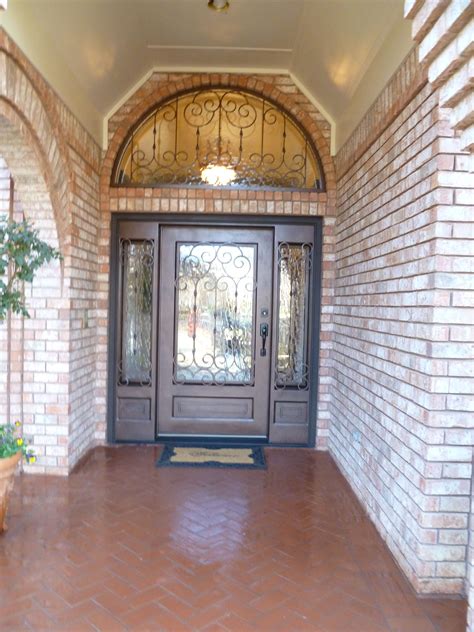 Over-sized Custom Single Wrought Iron door with transom and sidelights