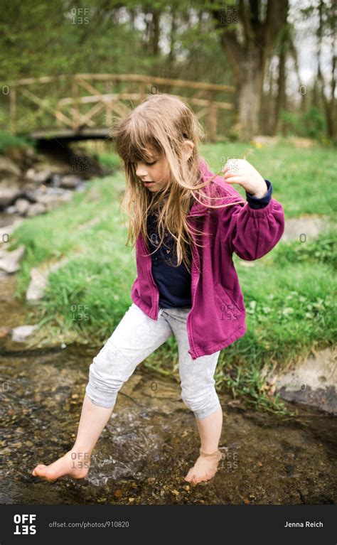 Young Girl Walking Barefoot In A Creek Stock Photo Offset