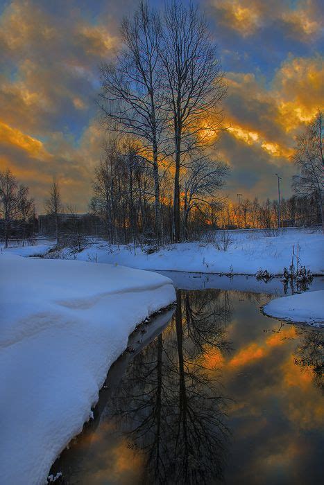 Burning Sky Winter Sunset With Reflected Clouds Surrounded By Snow Winter Scenery Winter