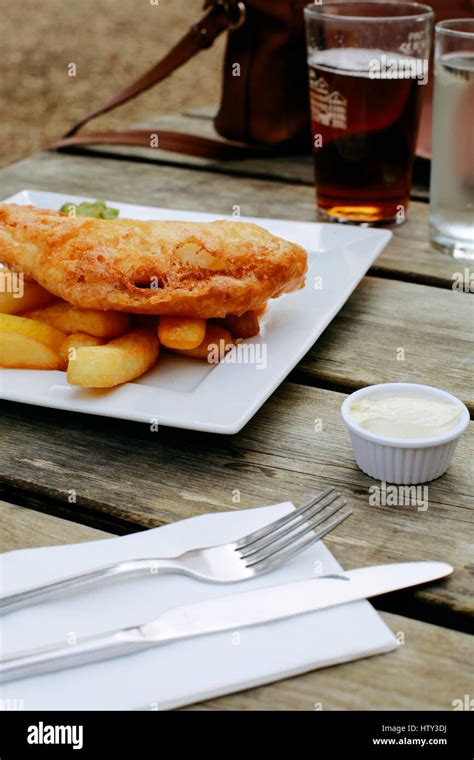 Fish And Chips Traditional English Dish On An Pub Outdoor Wooden