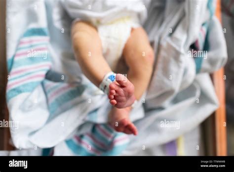 Overhead Newborn Feet In Hospital Bassinet Stretching Legs Stock Photo