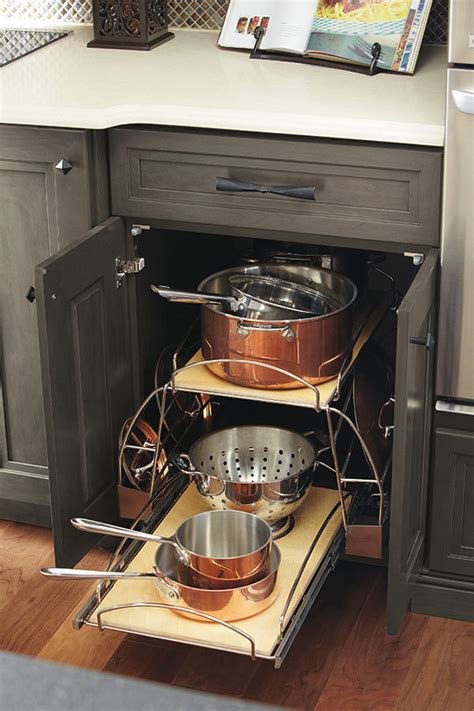 This has to be my favorite cabinet organizer for pots and pans. Pots and Pans Storage Pullout - Omega Cabinetry
