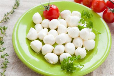 Small Balls Of Mozzarella On A Plate — Stock Photo © Olhaafanasieva