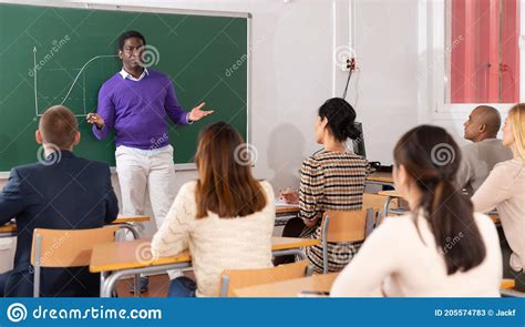 Teacher Explaining New Theme To Adult Students Stock Image Image Of