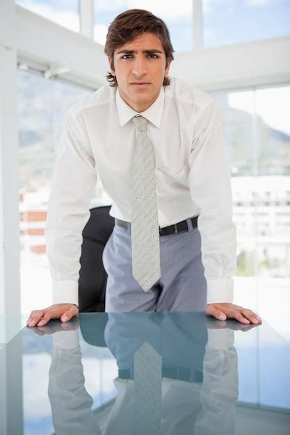 Premium Photo Young Serious Businessman Staring At The Camera