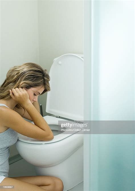 Young Woman Sitting Next To Toilet Photo Getty Images