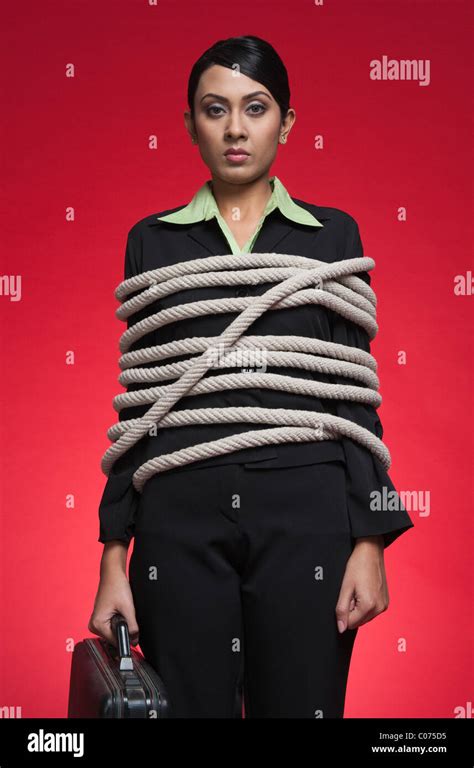 Portrait Of A Businesswoman Tied Up With Rope Stock Photo Alamy