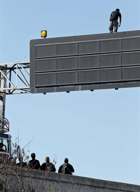 Man Standing On Sign Above Interstate 35 In San Antonio Lured Down