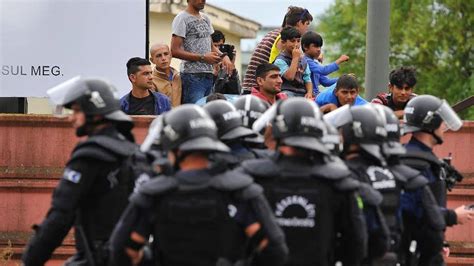 Police In Hungary Use Tear Gas To Stop Fighting Between Hundreds Of