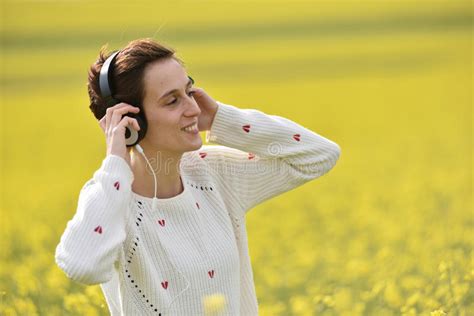 beautiful woman girl listening to music in headphone stock image image of female outdoors