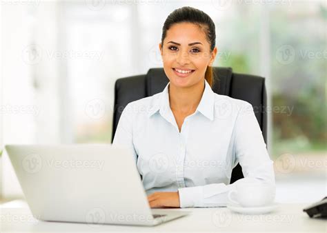 Young Office Worker Sitting In Office 906143 Stock Photo At Vecteezy