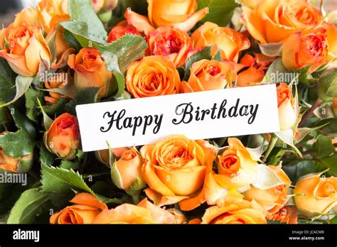 Happy Birthday Card With Bouquet Of Orange Roses Close Up Stock Photo