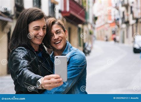 Happy Middle Aged Lesbian Couple Taking A Selfie Stock Photo Image Of Friends Marriage