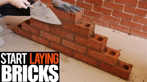 How To Lay Bricks For Beginner Brick Laying Brick Building A Brick Wall