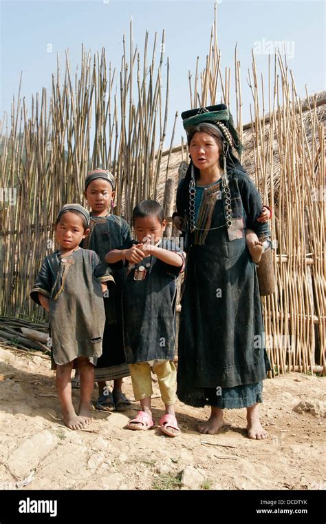 Ethnic Akha Woman And Children In Tribal Village Near Phongsali Laos