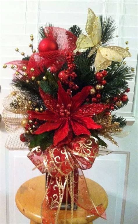 One light is placed behind the angel to light her wings at night. Christmas Arrangement Cemetary | Christmas flower ...