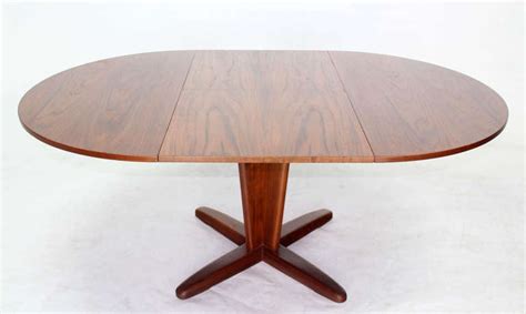 Available in different natural finishes, this table will be able to match different color schemes. Danish Mid Century Modern Round Dining Table with ...