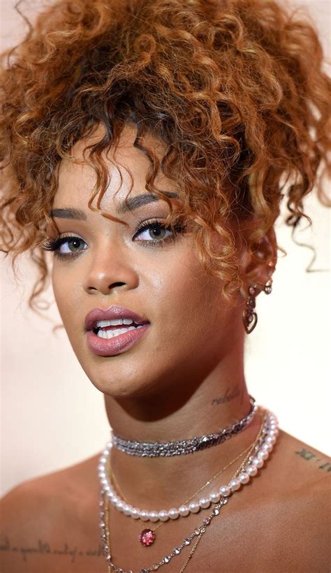 Rihanna Dons 80s Themed Pink Outfit For Her Perfume Launch Photos
