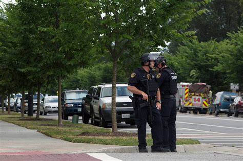 An fbi agent at the scene of the mass shooting in the virginia beach municipal center. 11 people killed in Virginia Beach shooting; suspect dead ...