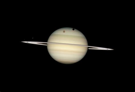 Four Moons Of Saturn Passing In Front Of It Rare Quadruple Transit