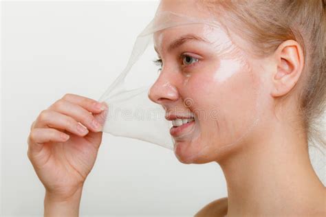Woman Removing Facial Peel Off Mask Stock Photo Image Of Face Peel