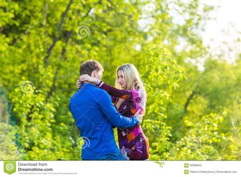 Beautiful Young Love Couple Hugging In The Park Stock Photo Image Of
