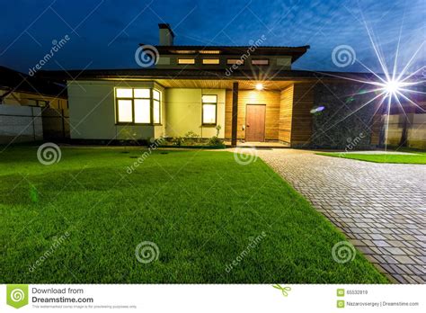 Detached Luxury House At Night View From Outside Front