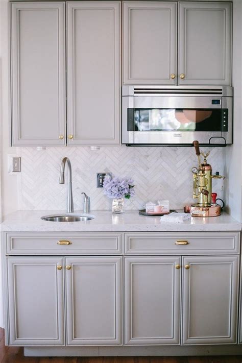 Consider these dark kitchen cabinet colors to bring drama and contrast. Look We Love: Gray Kitchen Cabinets with Brass Hardware ...