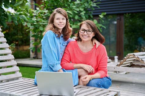 Portrait Of Happy Mom And Teenage Daughter Looking At Camera Stock Image Image Of Middle