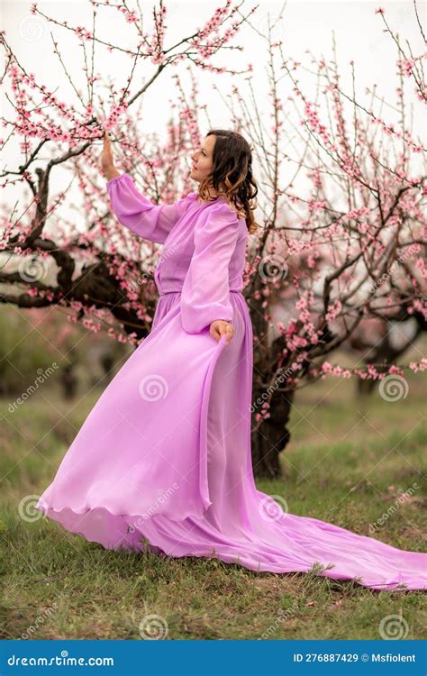 Woman Peach Blossom Happy Curly Woman In Pink Dress Walking In The