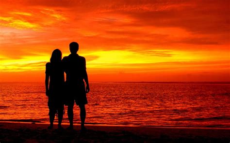 Romantic Couple On Beach Sea Red Sky Sunset Wallpaper Hd : Wallpapers13.com