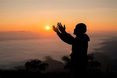 Premium Photo Silhouette Of Christian Man Praying At Sunset