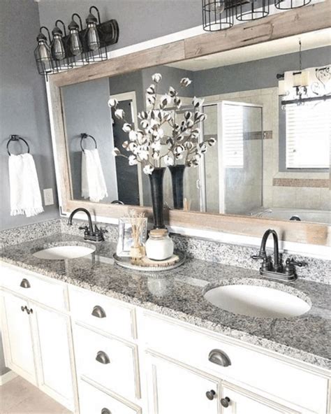 A Bathroom With Two Sinks And A Large Mirror
