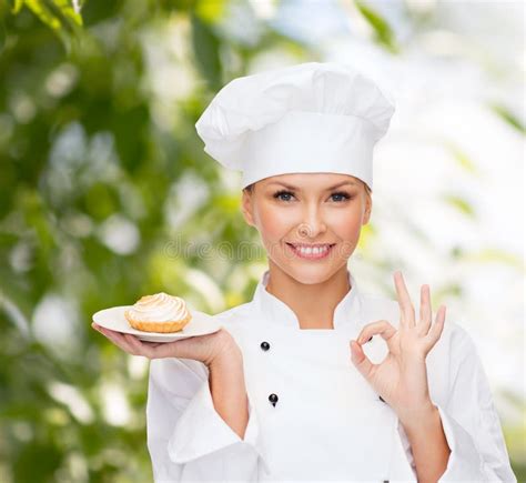 Smiling Female Chef With Cake On Plate Stock Photo Image 38574766