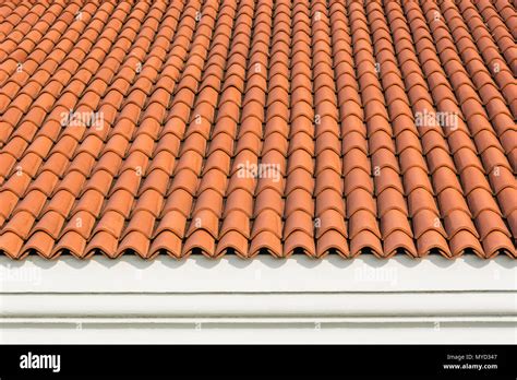 Red Corrugated Tile Element Of Roof At House And White Wall Shingles