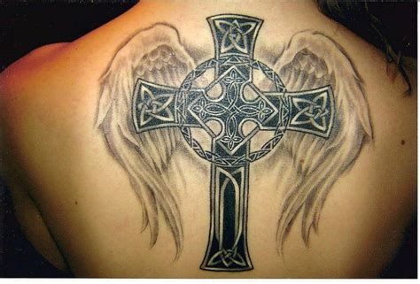 A Celtic Cross Tattoo With Angel Wings Celebrates Both Christianity And