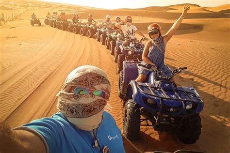 Enjoy the sunset, sandboarding, camel ride and visit the camel firm. Red Dunes By Quad Bike, Sandsurf, Camels & BBQ at Al ...