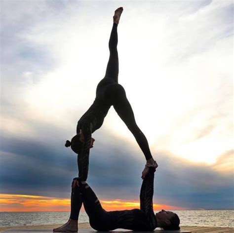 This yoga pose for two people easy is ideal for working toward forearm bridge. #yoga #yogainspiration | Partner yoga poses, Couples yoga poses, Acro yoga poses