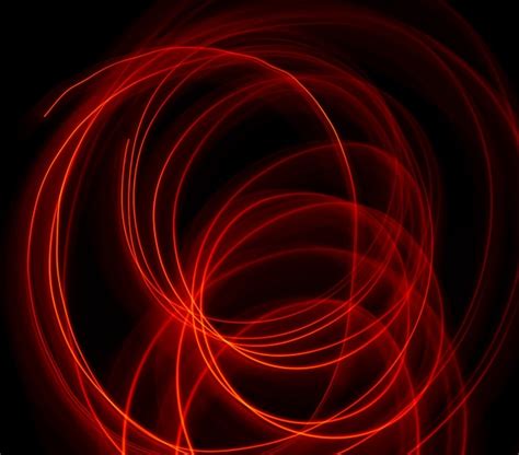 Premium Photo Vibrant Neon Red Color In Abstract Swirls