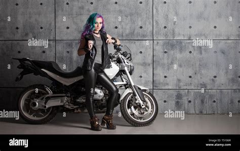Biker Chick In Front Of Motorcycle Beautiful And Pert Young Woman In