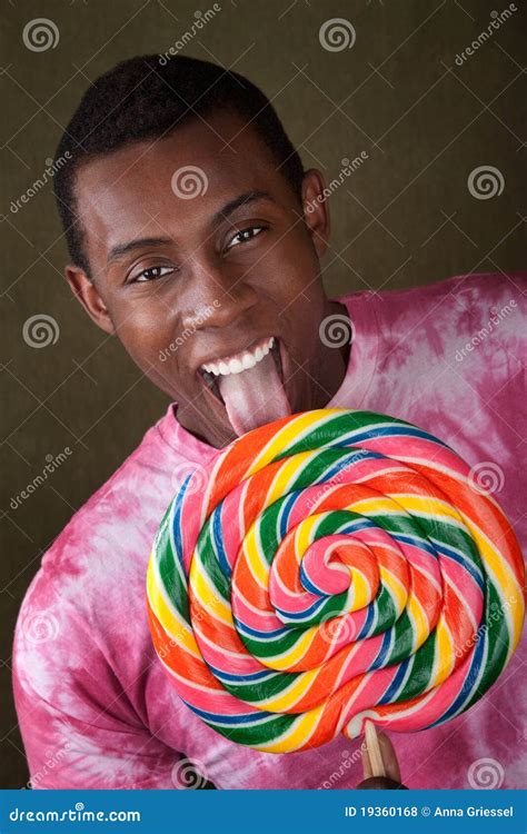 Man Licks Giant Candy Sucker Stock Photo Image Of Cute Single 19360168