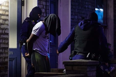 police launch dawn raids targeting ‘drug gang linked to knife murders in camden london
